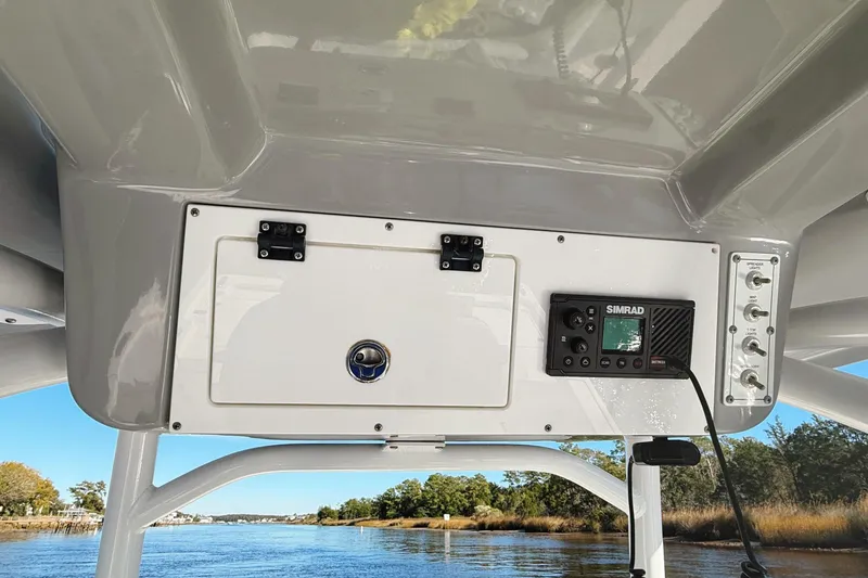 Slide: The Image of 2021 Sea Pro 248 Bay boat console with Simrad electronics on a scenic waterway. - 20