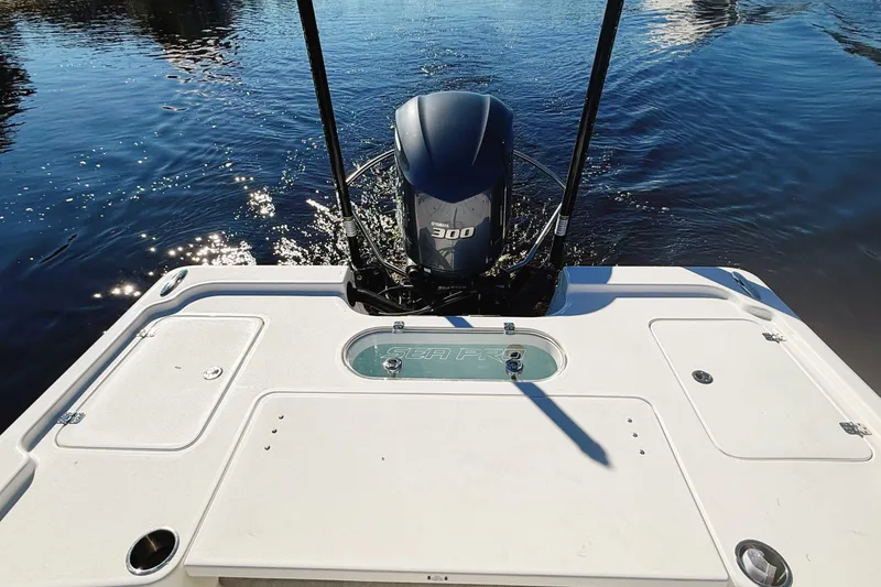 Slide: The Image of 2021 Sea Pro 248 Bay boat with powerful 300 engine on calm water. - 8