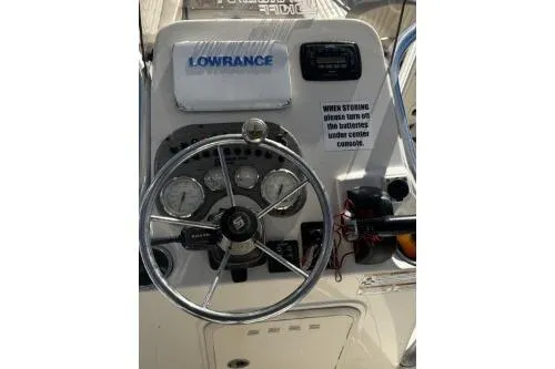 Slide: The Image of 2018 Carolina Skiff Ultra Series boat dashboard with steering wheel and Lowrance equipment. - 10