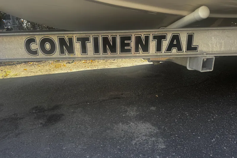 Slide: The Image of Trailer with "Continental" branding for 2018 Carolina Skiff Ultra Series boat. - 12