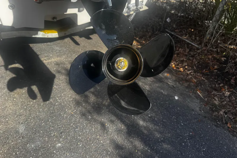 Slide: The Image of 2018 Carolina Skiff Ultra Series boat propeller on asphalt background. - 13