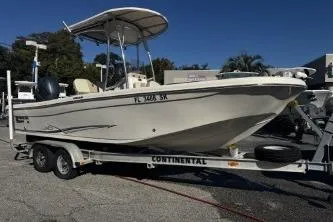 Slide: The Image of 2018 Carolina Skiff Ultra Series boat on a Continental trailer in a parking lot. - 4