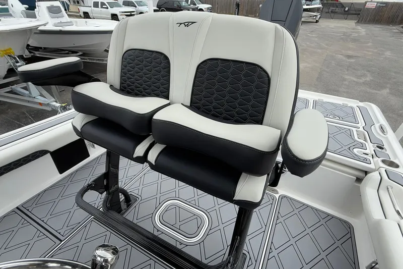 Slide: The Image of 2024 Tidewater 2500 Carolina Bay boat seats with black and white upholstery. - 10
