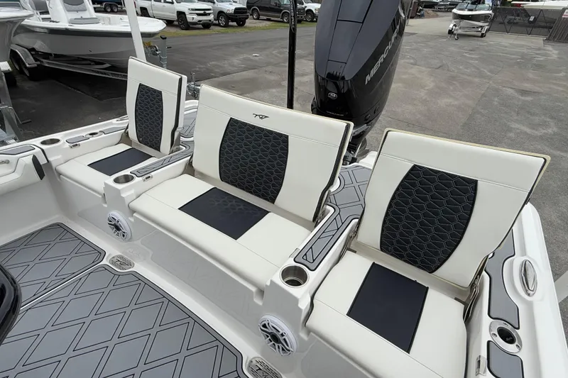 Slide: The Image of 2024 Tidewater 2500 Carolina Bay boat interior with stylish seating and modern design. - 12