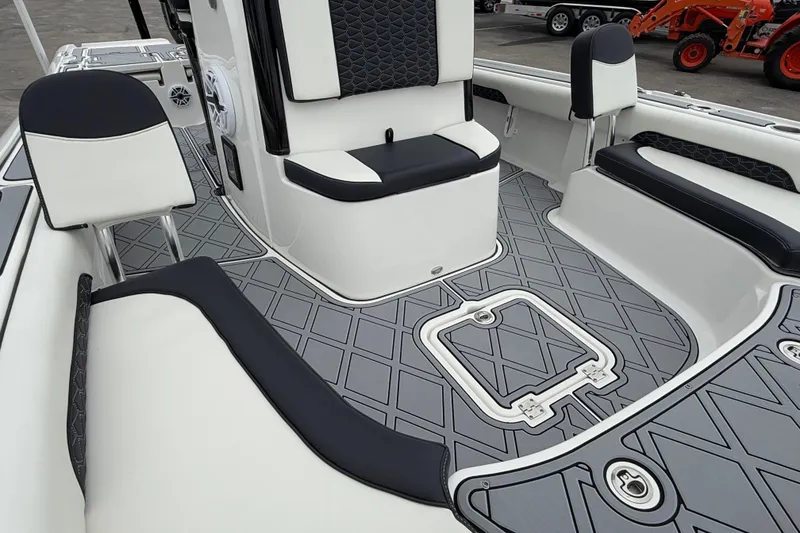 Slide: The Image of 2024 Tidewater 2500 Carolina Bay boat interior with stylish seating and non-slip flooring. - 6