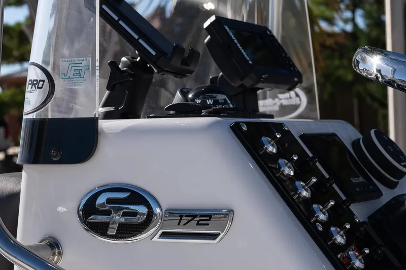 Slide: The Image of 2026 Sea Pro 172 Bay boat dashboard with controls and navigation equipment. - 10