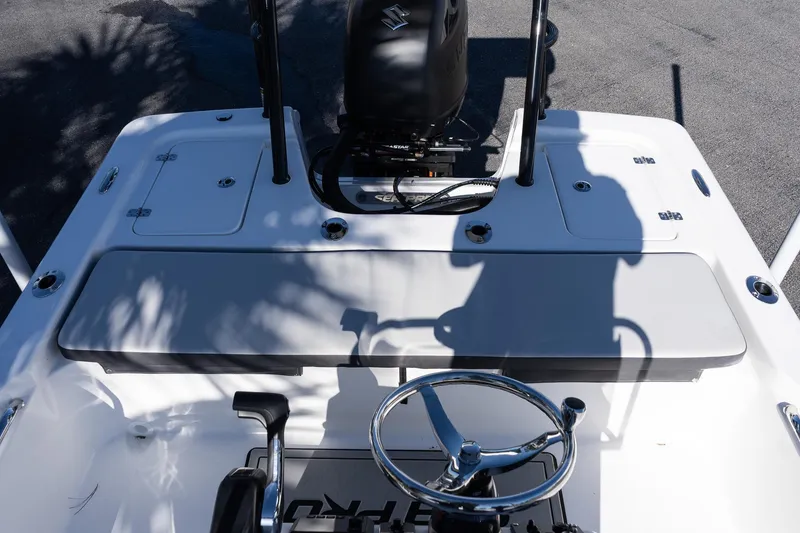 Slide: The Image of 2026 Sea Pro 172 Bay boat interior with steering wheel and motor, showcasing sleek design. - 11