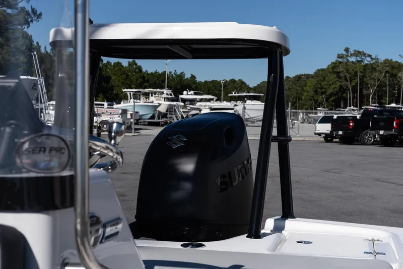 Slide: The Image of 2026 Sea Pro 172 Bay boat with Suzuki outboard motor in a marina setting. - 19