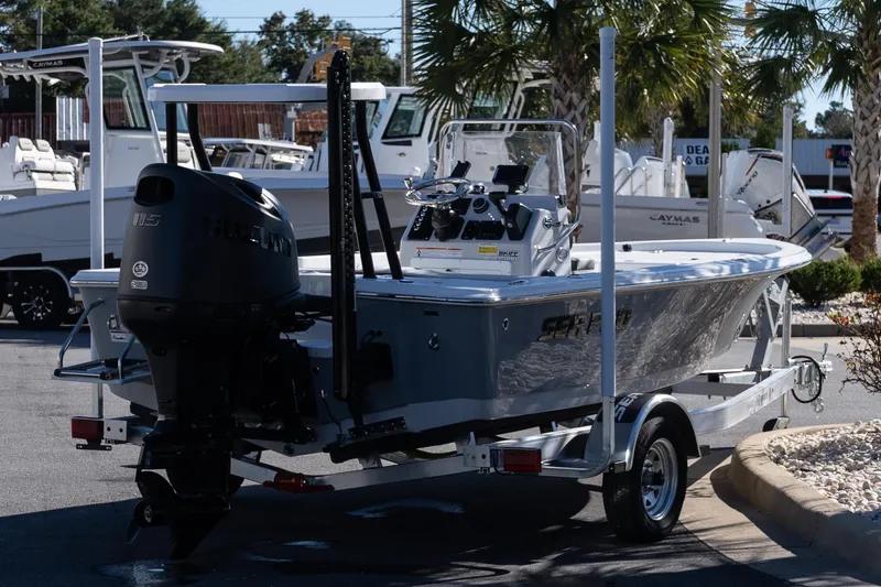 Slide: The Image of 2026 Sea Pro 172 Bay boat on trailer, displayed outdoors with palm trees. - 7
