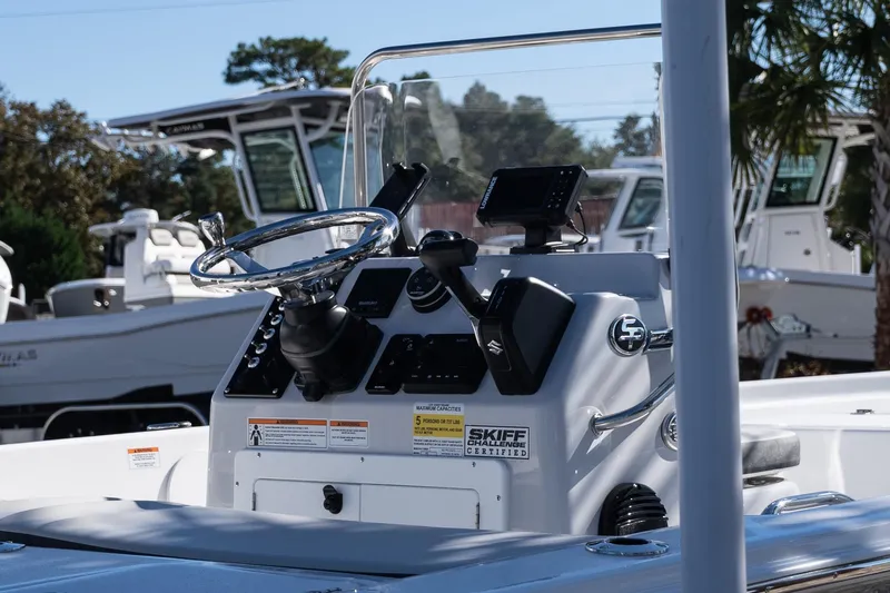 Slide: The Image of 2026 Sea Pro 172 Bay boat console with steering wheel and navigation equipment. - 8