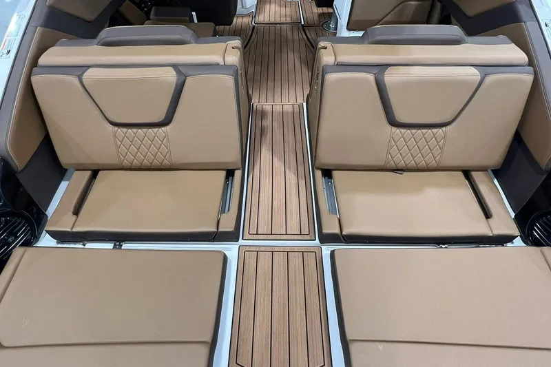 Slide: The Image of 2025 Yamaha Boats 252SD interior with tan leather seats and wood flooring. - 5