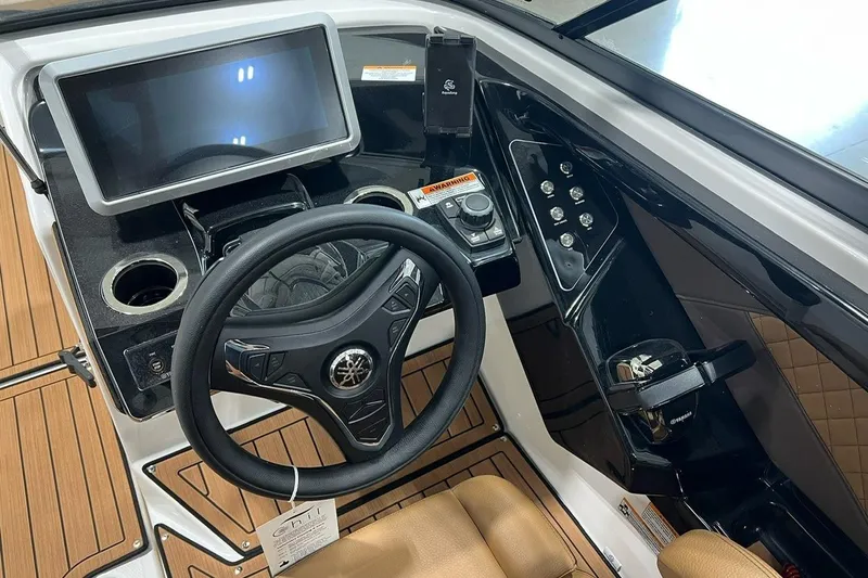 Slide: The Image of 2025 Yamaha Boats 252SD dashboard with steering wheel, touchscreen, and control panel. - 6