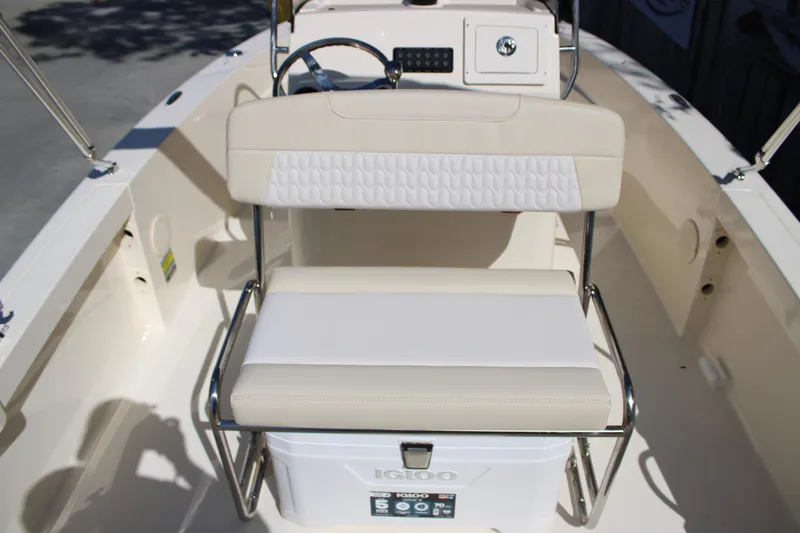 Slide: The Image of 2026 Scout 188 Sportfish boat interior with cushioned seating and Igloo cooler. - 15
