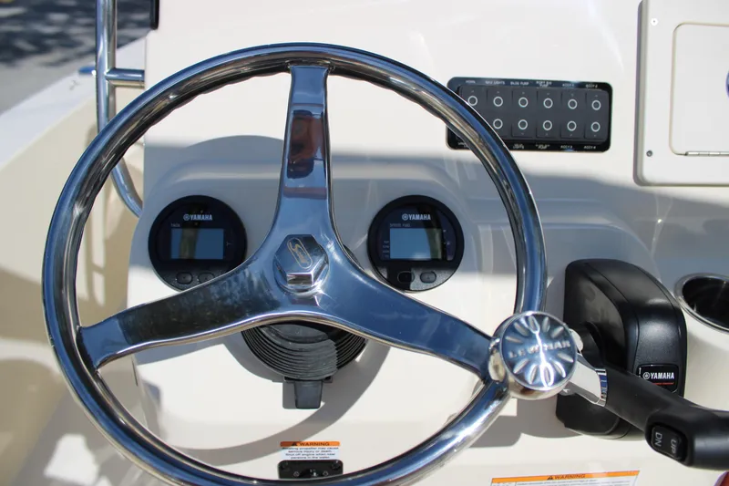 Slide: The Image of Steering wheel and controls of 2026 Scout 188 Sportfish boat. - 17