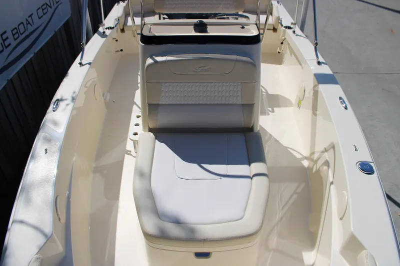 Slide: The Image of 2026 Scout 188 Sportfish boat interior with seating and console, showcasing sleek design. - 19