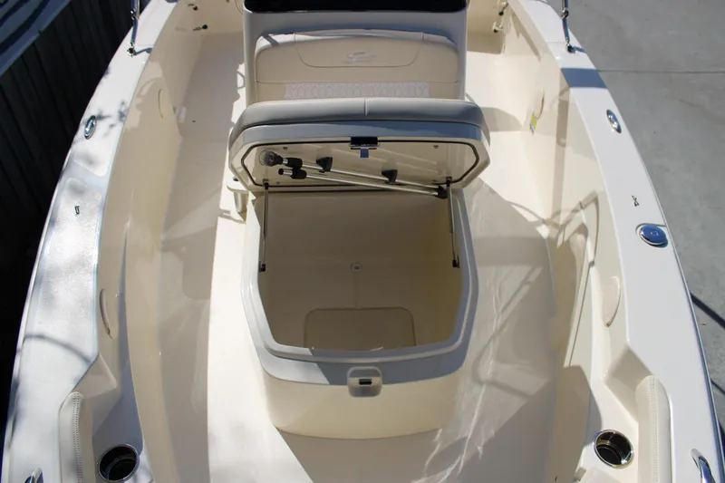 Slide: The Image of 2026 Scout 188 Sportfish boat with open storage compartment on deck. - 20