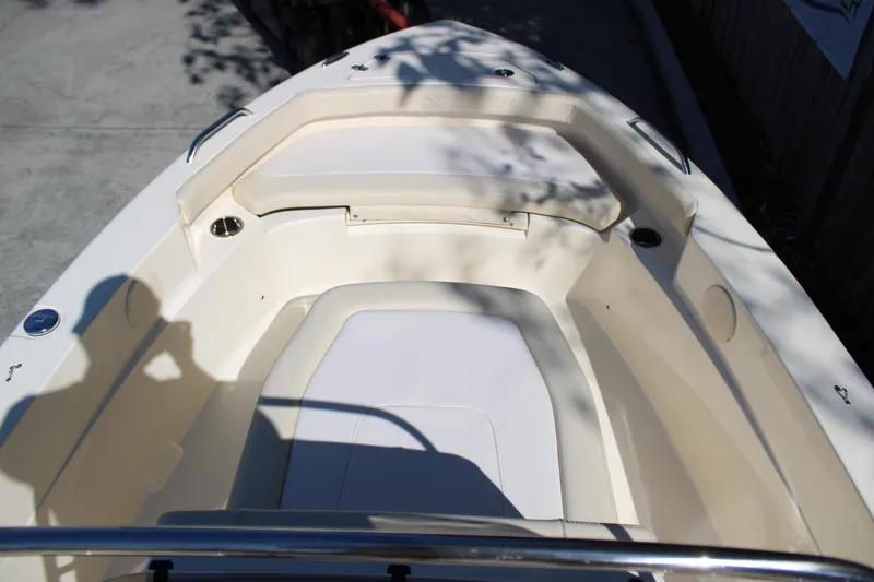 Slide: The Image of 2026 Scout 188 Sportfish boat interior with seating and cup holders. - 21