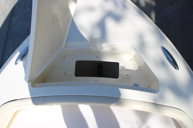 Slide: The Image of Open storage compartment on 2026 Scout 188 Sportfish boat. - 24
