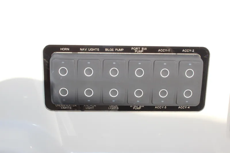 Slide: The Image of Control panel of 2026 Scout 188 Sportfish boat with labeled switches. - 28