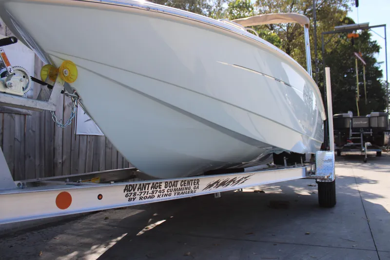 Slide: The Image of 2026 Scout 188 Sportfish boat on trailer at Advantage Boat Center. - 29