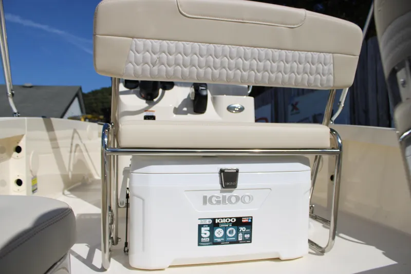 Slide: The Image of 2026 Scout 188 Sportfish boat interior with Igloo cooler and cushioned seating. - 30