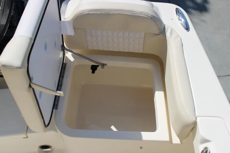 Slide: The Image of Open storage compartment on 2026 Scout 188 Sportfish boat, featuring cushioned seating. - 9