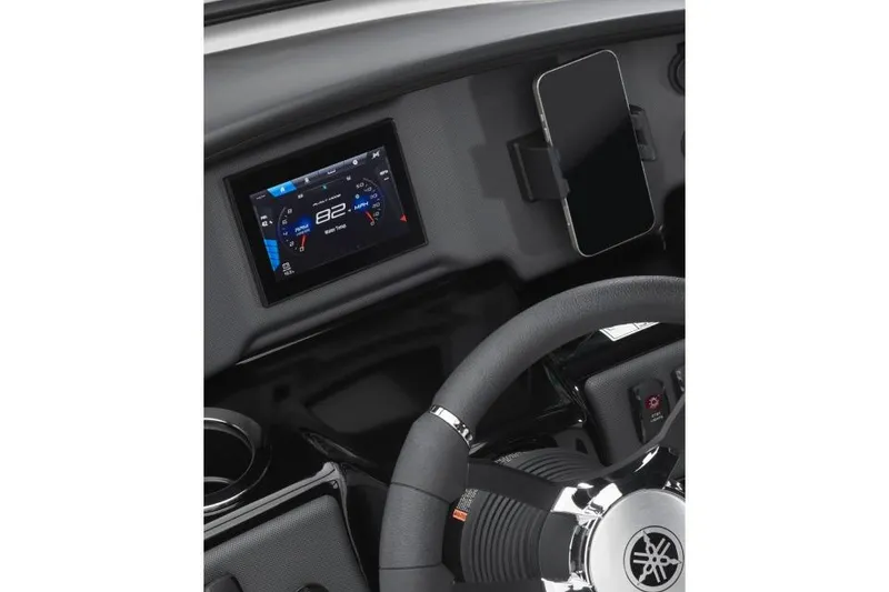 Slide: The Image of Manufacturer Provided Image: Dashboard of 2026 Yamaha Boats SX195 with digital display and smartphone holder. - 3