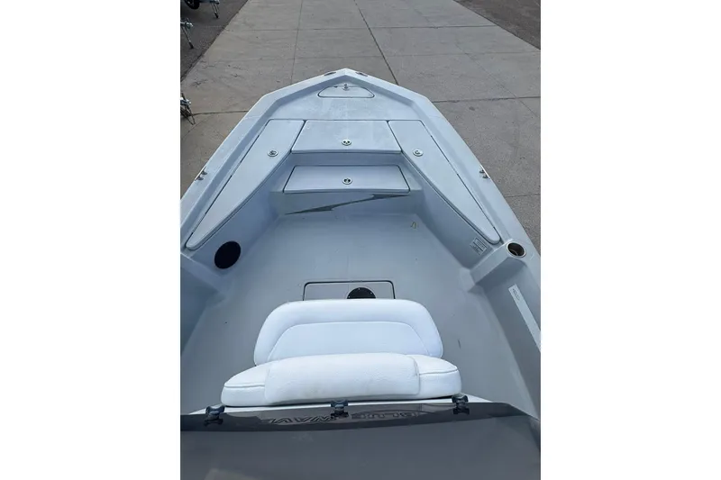 Slide: The Image of 2016 BLUEWAVE 2200 boat interior with seating and storage compartments. - 6