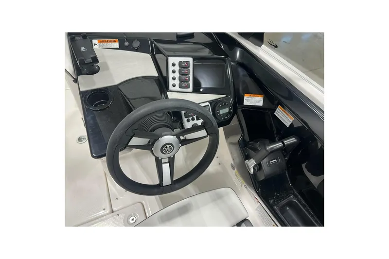 Slide: The Image of 2025 Yamaha Boats AR220 dashboard with steering wheel and control panel. - 7