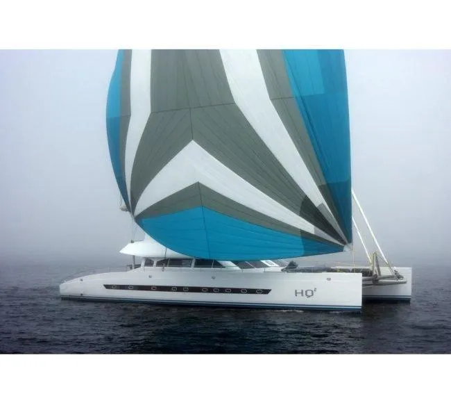 The Image of Sailing catamaran "Two Oceans OPEN OCEAN 750S" with colorful sails on misty water. - 0