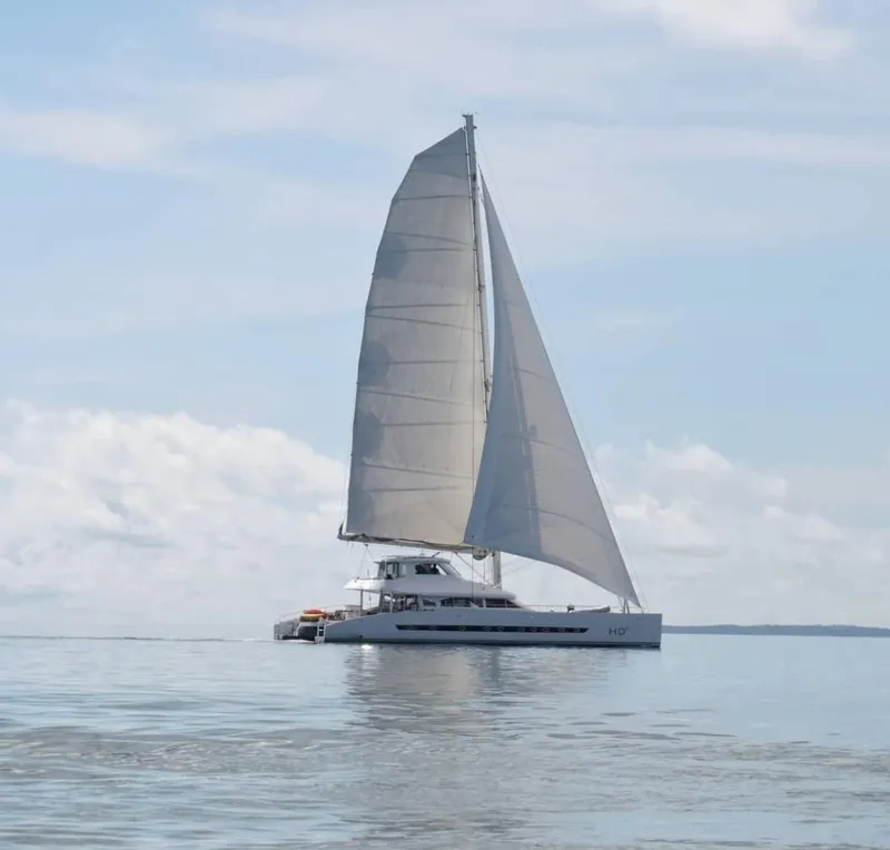 Slide: The Image of Sailing catamaran Two Oceans OPEN OCEAN 750S, 2013, on calm waters under clear skies. - 2