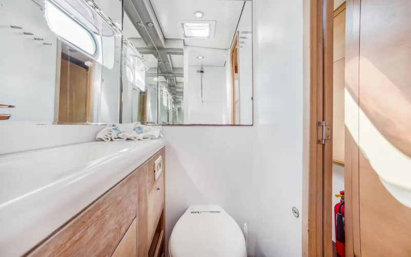 Slide: The Image of Luxurious bathroom in 2013 Two Oceans OPEN OCEAN 750S yacht, featuring modern fixtures and wood accents. - 48