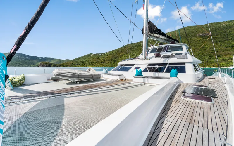 Slide: The Image of Luxury Two Oceans OPEN OCEAN 750S yacht deck with scenic mountain backdrop. - 8