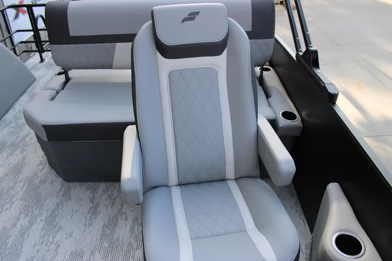 Slide: The Image of 2026 Starcraft EXS 1 Q DH boat interior with gray and white seating. - 14