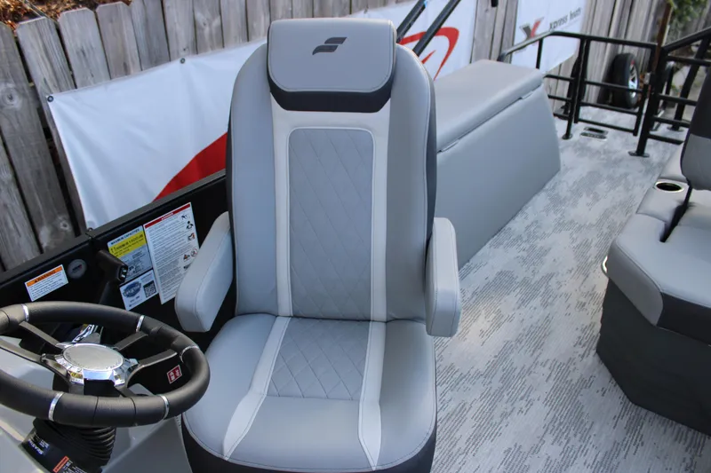 Slide: The Image of Captain's chair on 2026 Starcraft EXS 1 Q DH boat, featuring sleek design and modern upholstery. - 15