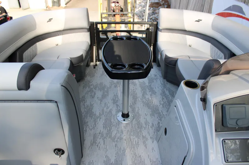 Slide: The Image of Luxurious interior of 2026 Starcraft EXS 1 Q DH pontoon boat with seating and table. - 18