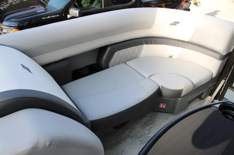 Slide: The Image of Luxurious seating on 2026 Starcraft EXS 1 Q DH boat, featuring sleek gray upholstery. - 20