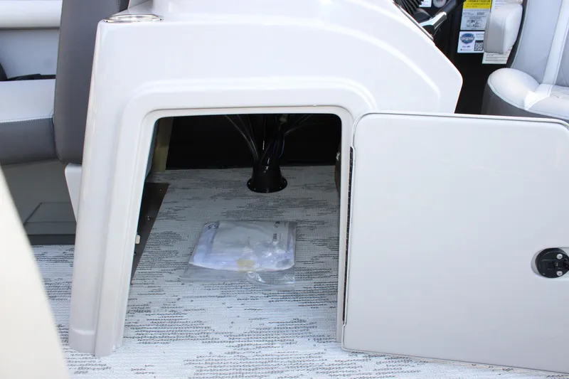 Slide: The Image of Open storage compartment in 2026 Starcraft EXS 1 Q DH boat interior. - 21