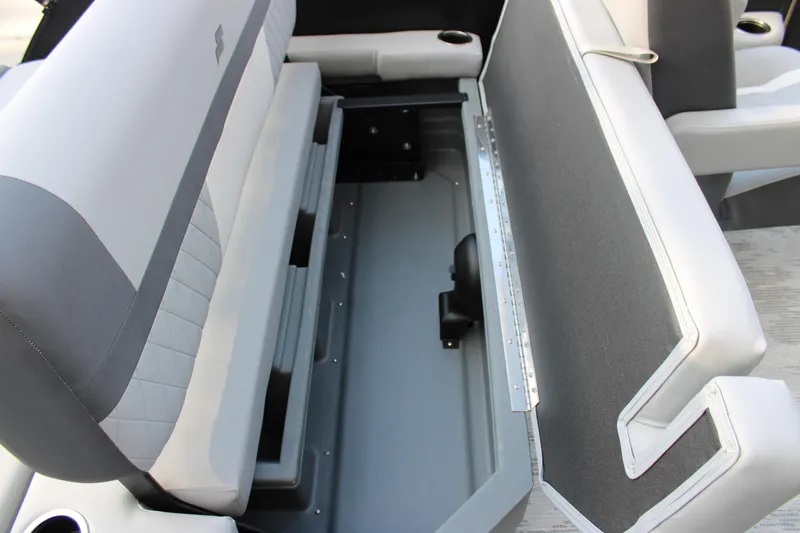 Slide: The Image of 2026 Starcraft EXS 1 Q DH boat seat with open storage compartment. - 29