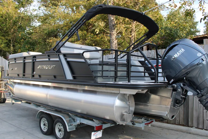 Slide: The Image of 2026 Starcraft EXS 1 Q DH pontoon boat with Yamaha motor on trailer. - 3