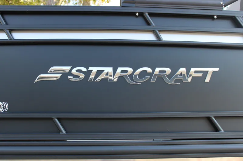 Slide: The Image of 2026 Starcraft EXS 1 Q DH logo on a sleek black surface. - 31