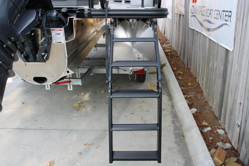 Slide: The Image of Rear view of 2026 Starcraft EXS 1 Q DH boat with ladder and motor. - 6