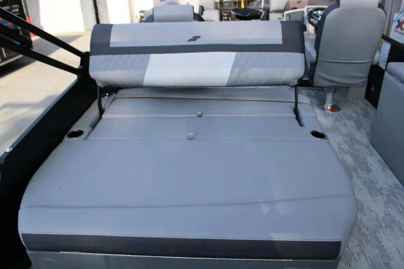 Slide: The Image of 2026 Starcraft EXS 1 Q DH boat interior with gray cushioned seating and cup holders. - 8