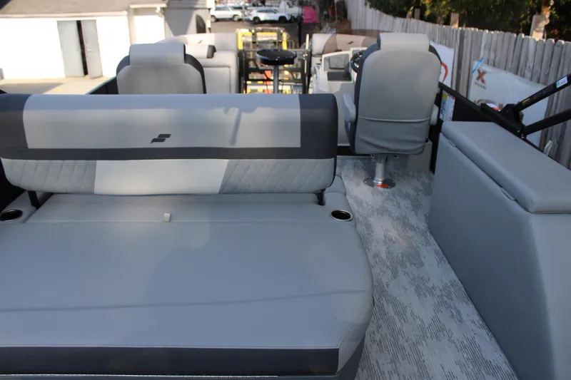 Slide: The Image of 2026 Starcraft EXS 1 Q DH boat interior with gray seating and modern design. - 9