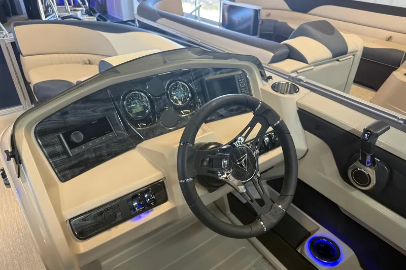 Slide: The Image of 2026 Tahoe Pontoon LTZ Quad Lounger Shift dashboard with steering wheel and controls. - 3