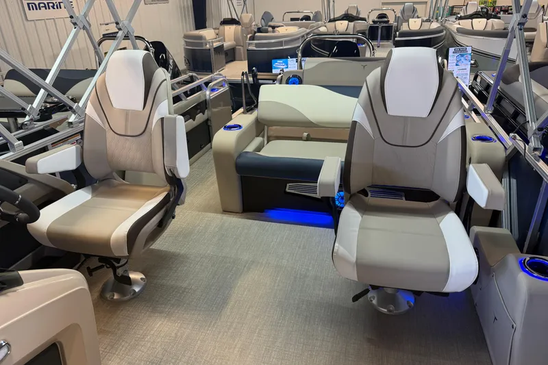 Slide: The Image of 2026 Tahoe Pontoon LTZ Quad Lounger Shift interior with modern seating and ambient lighting. - 6