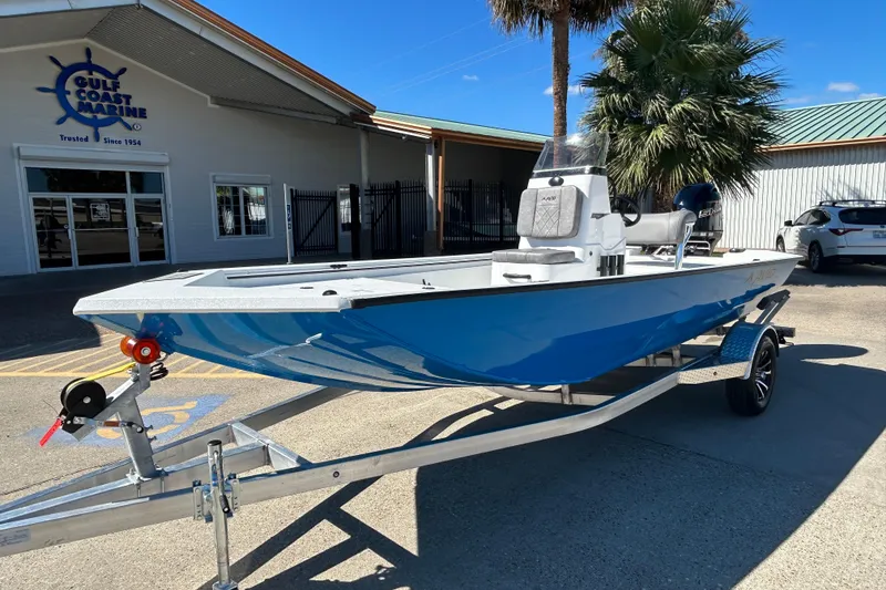 Slide: The Image of 2026 Avid 18 Rogue CC boat in blue on a trailer at Gulf Coast Marine. - 1