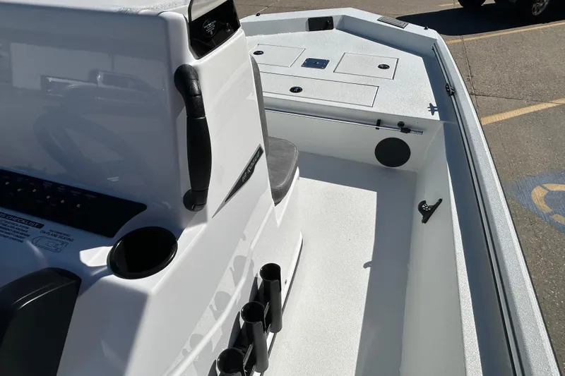 Slide: The Image of 2026 Avid 18 Rogue CC boat interior with console and seating area. - 12