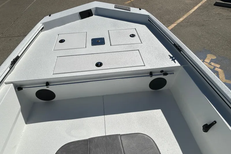 Slide: The Image of Interior view of 2026 Avid 18 Rogue CC boat, featuring storage compartments and seating. - 13