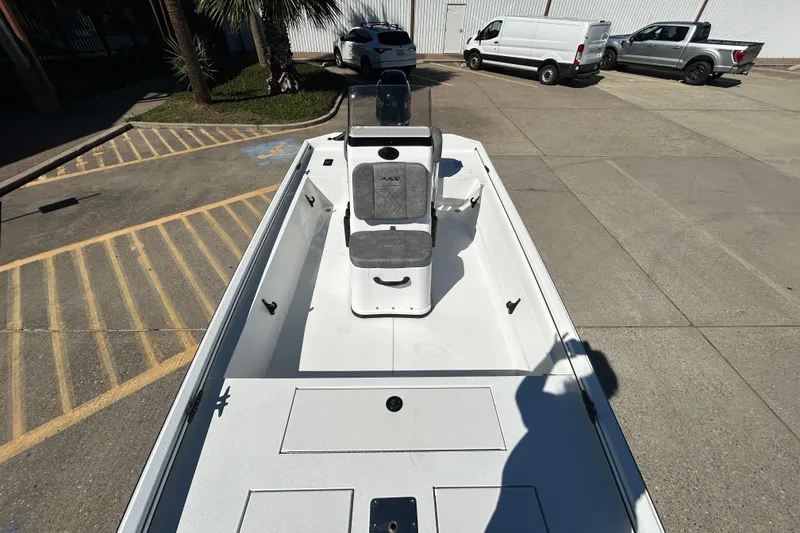 Slide: The Image of Avid 18 Rogue CC 2026 boat in parking lot, showcasing sleek design and seating. - 15